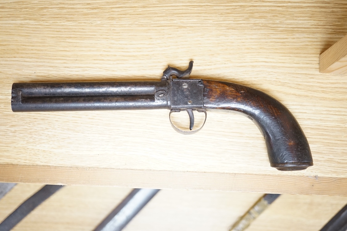 A boxlock percussion pocket pistol with Damascus twist turn off barrel, liege proofs, rounded wooden grip replaced, together with an ‘over and under’ boxlock percussion pistol